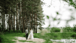 Just married husband and wife walking near forest