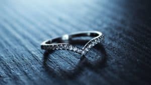 woman's wedding ring on table