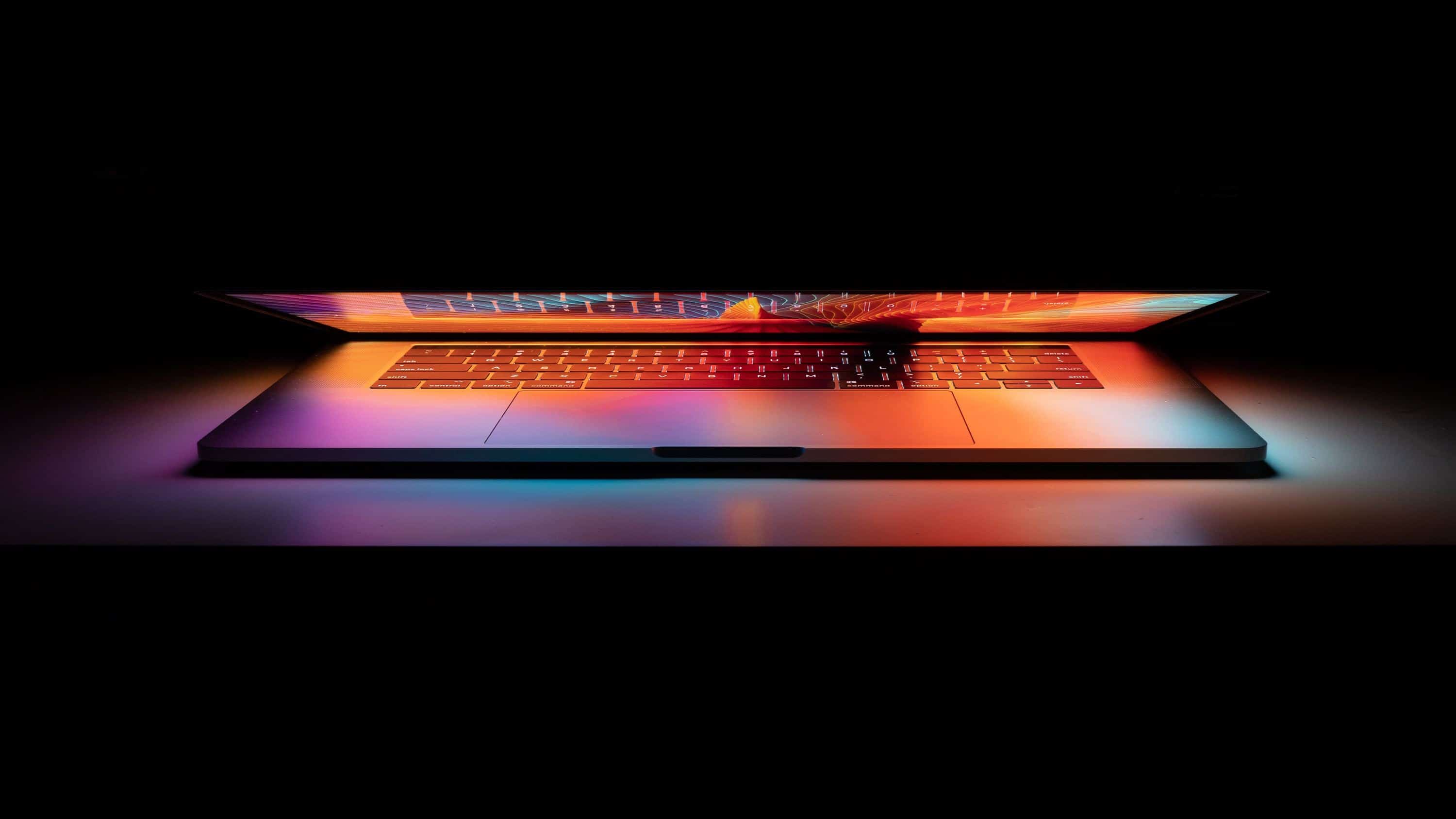 lighted computer on desk