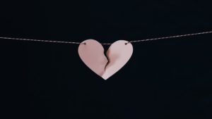 paper heart ripped in half on string
