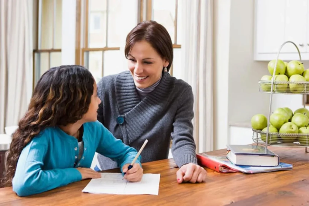 Stepmom helping child do her homework