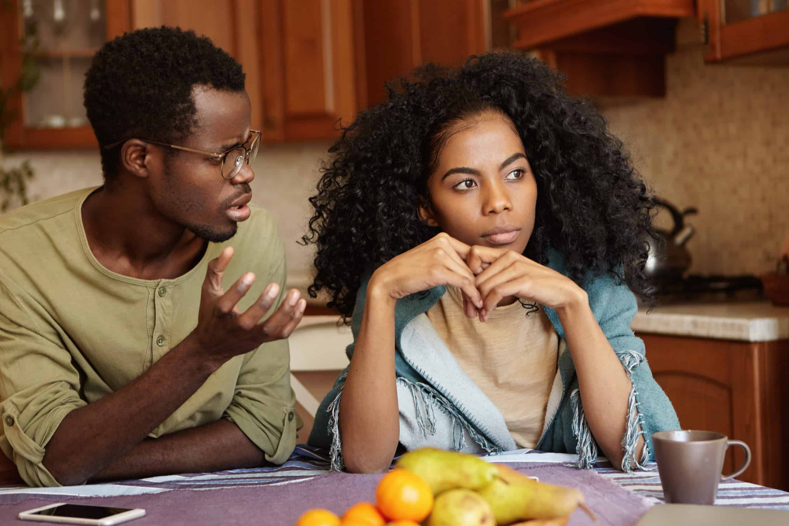 an african american couple argue over infidelity