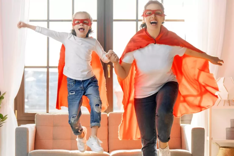 build a relationship with your child - this mom is playing super hero dress up with her daughter