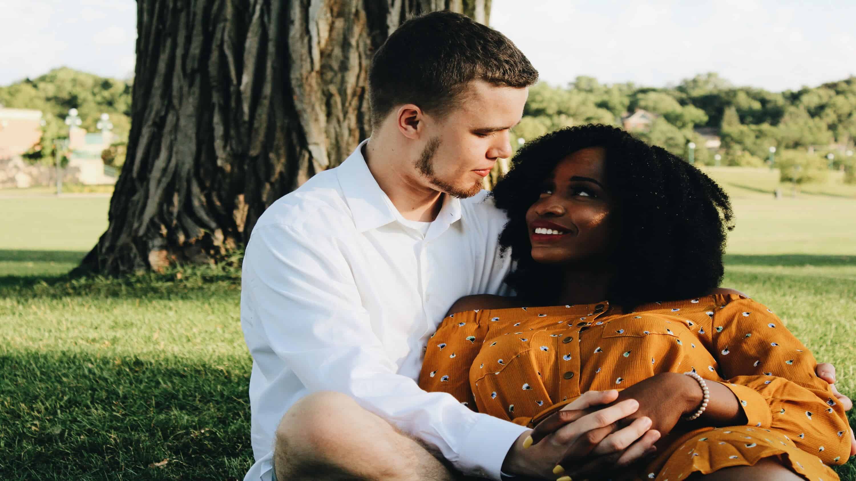 man holding woman in arms