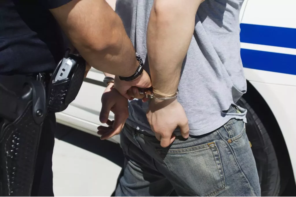 establishing boundaries with adult children: police handcuffing a young adult man