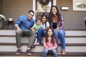 Adoptive Family sitting on steps