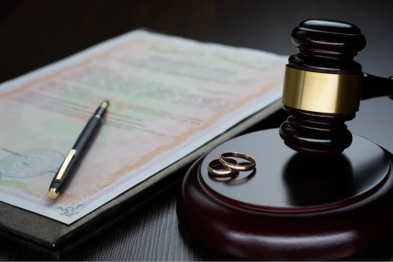 A judge’s gavel, two wedding rings, and a legal document symbolize the question of whether the divorce rate in the church is as high as in the world.