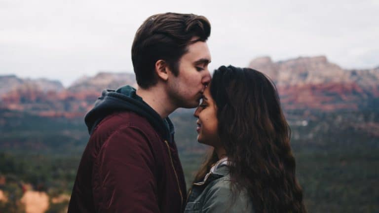 couple intimacy husband kissing wife's forehead