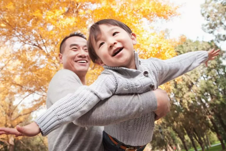 You can transform from fearful to fearless as a parent- The young boy has his arms out as if he was an airplane