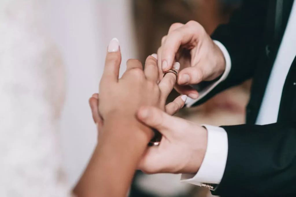 Man and woman exchanging wedding vows