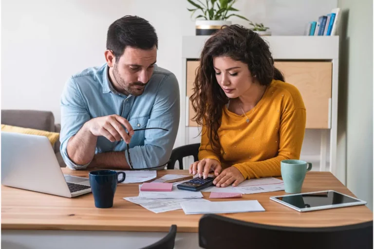 "How can my spouse and i get out of debt?" This is the question this couple asked of their financial advisor and now they are sitting down at the table together, going over their budget and spending, and finding ways to get out of debt.