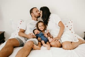 Young family showing the SLED test that all are human