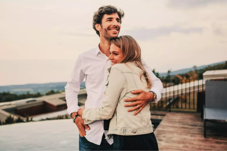 Growing closer to God and to each other — a joyful couple embraces lovingly outdoors, radiating peace and unity.