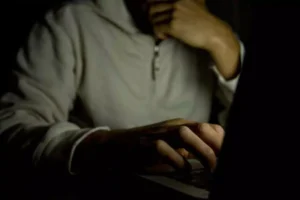Teen looking at the laptop