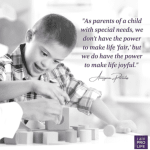 A young child with special needs plays with blocks - a reminder that love and hope is a key to overcoming guilt.