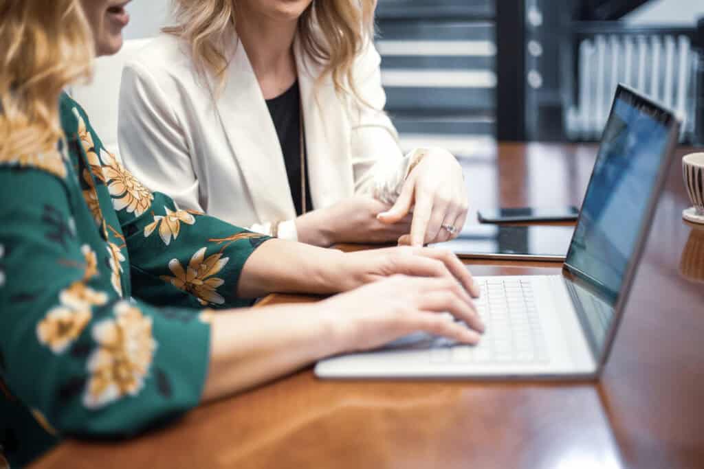 women working together at computer