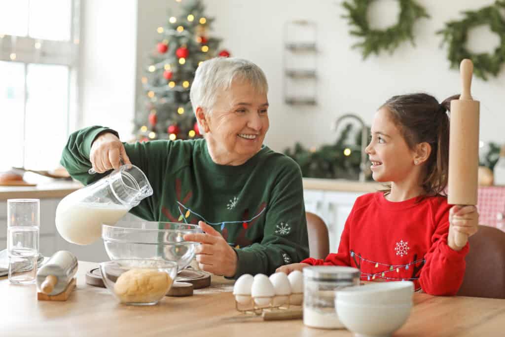 Grandma and granddaughter baking Christmas time
