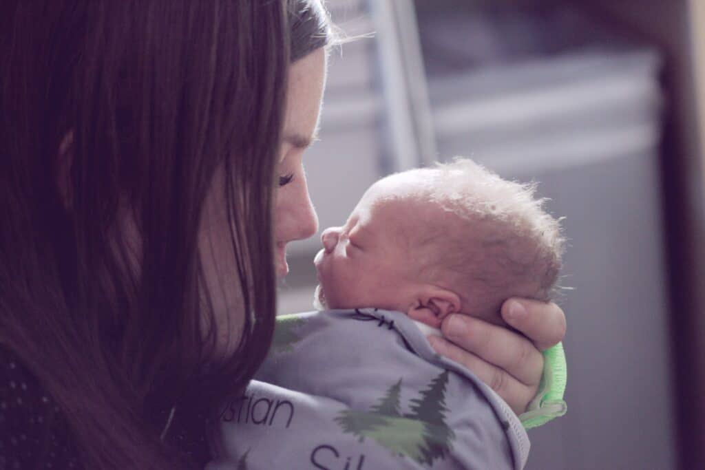 woman holding newborn