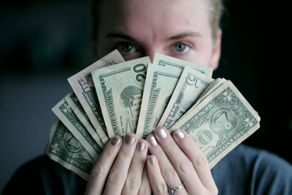 Wpman fanning out dollar bills
