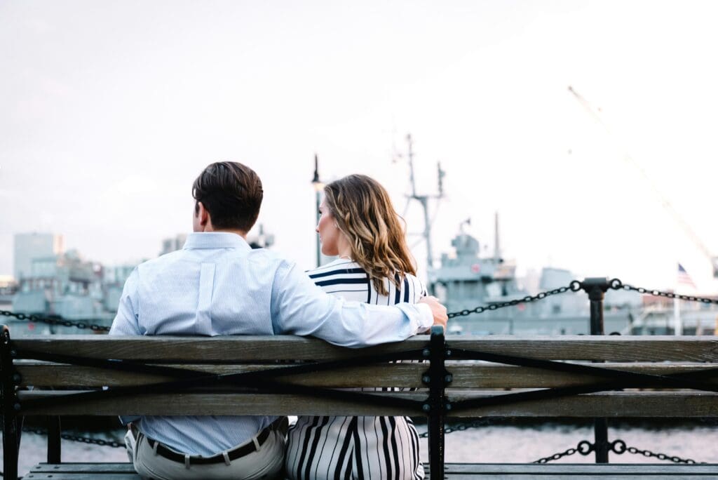 couple on bench by water