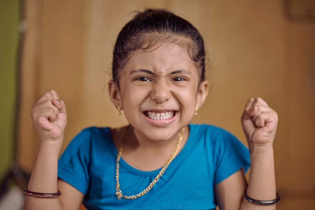 girl angry clenching fists