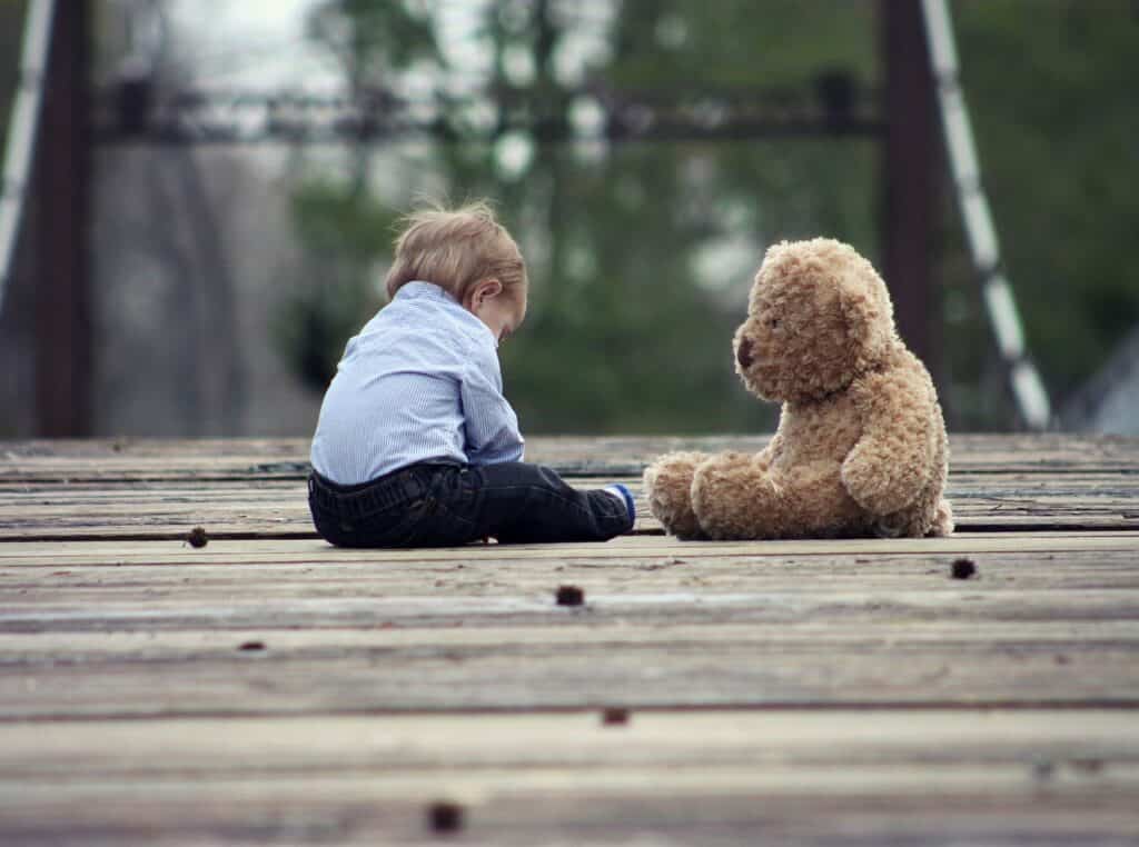 Little child with teddy bear