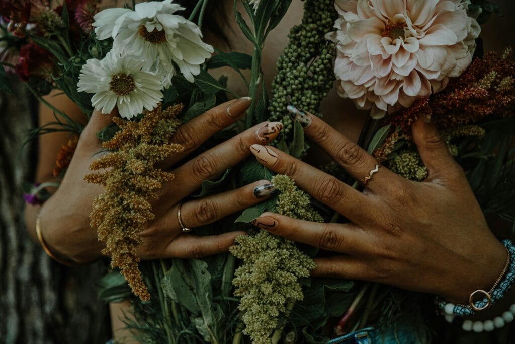 woman covering herself with flowers