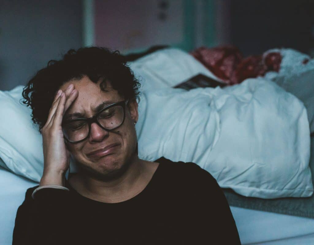 upset woman holding her head
