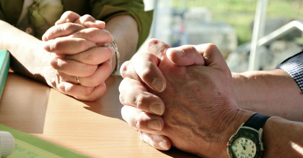 male and female sets of praying hands