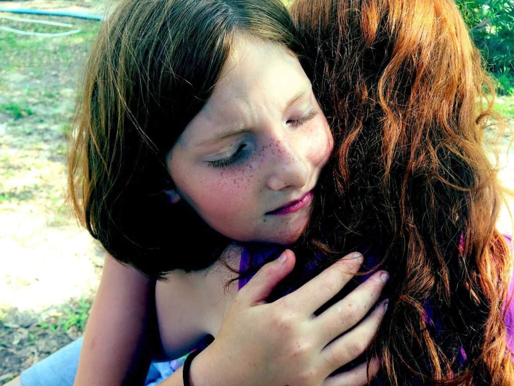 Girl hugging friend