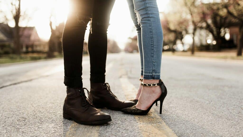 Feet of man and woman standing close together