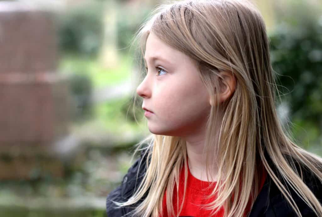 sullen unhappy girl staring off