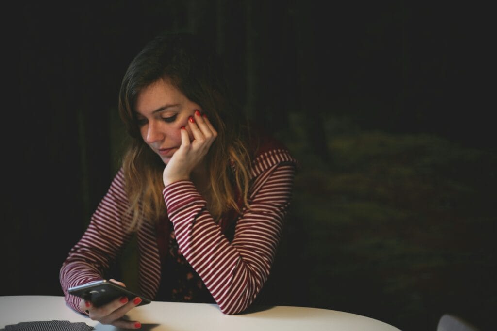 woman scrolling on phone