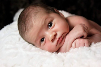 wide-eyed newborn baby