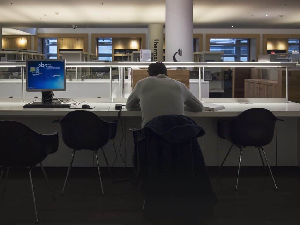 man working late in library