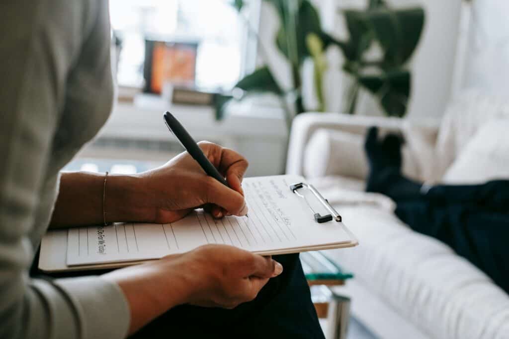 hands holding notepad counselor therapist