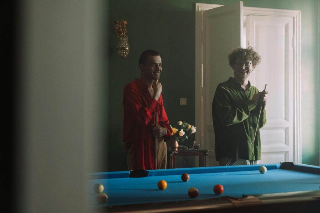 men playing pool