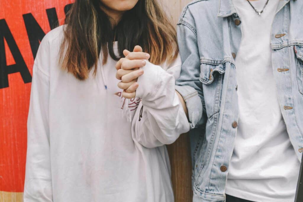 young couple holding hands