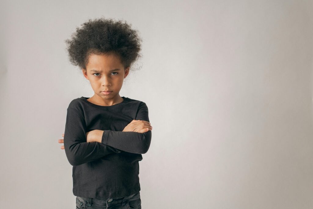little girl with arms crossed