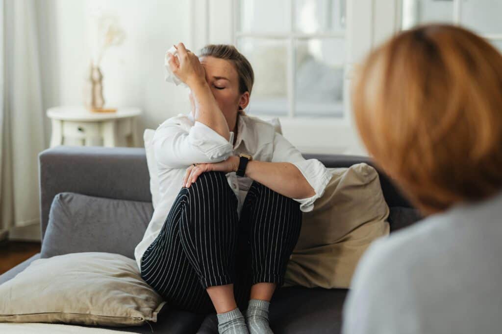 two women talking one crying