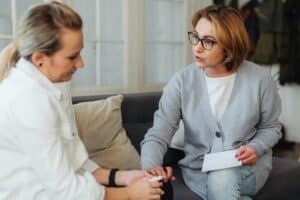 counselor therapist comforting woman
