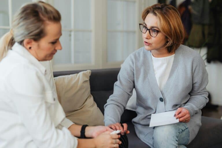 counselor therapist comforting woman