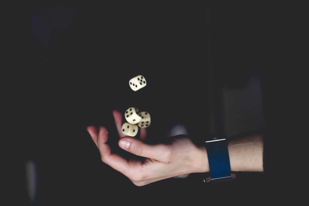 hand rolling dice
