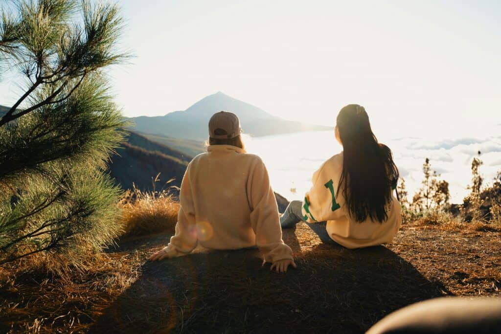 couple looking at lake and mountain