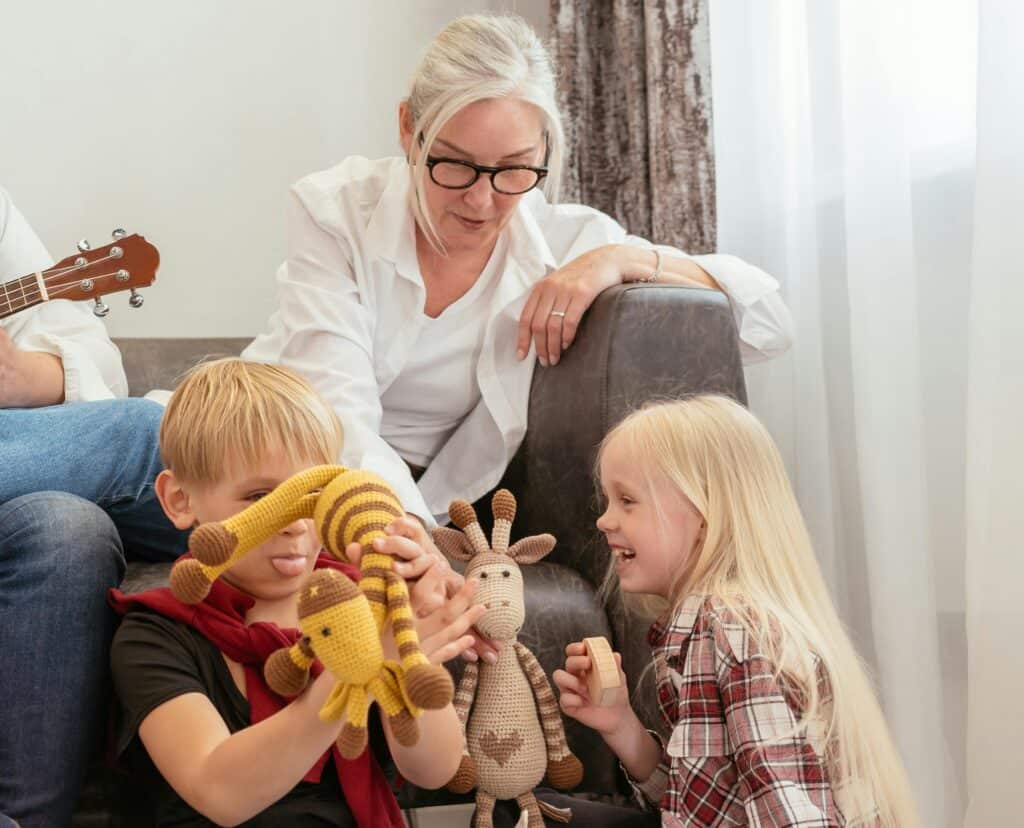 Grandmother with grandkids and lots of toys