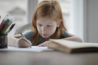 Little girl writing
