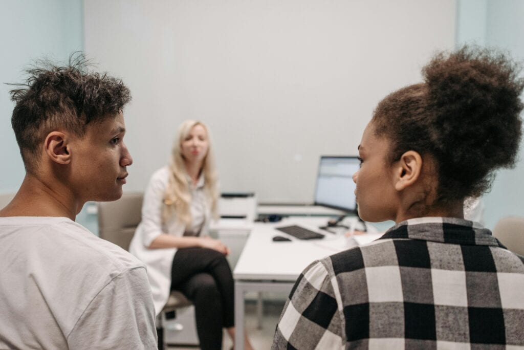 couple looking at one another in doctor's office