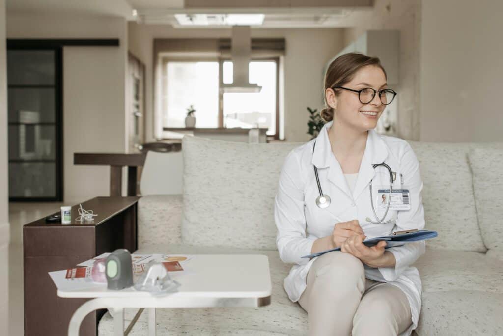 home health nurse sitting on couch