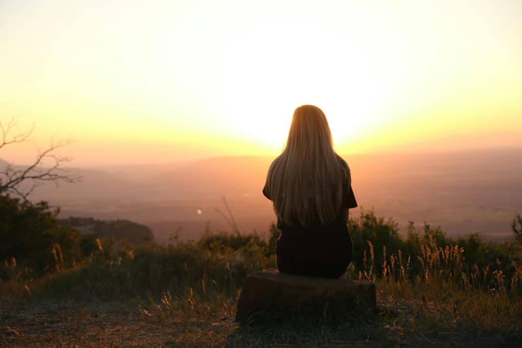 girl back to camera at sunrise