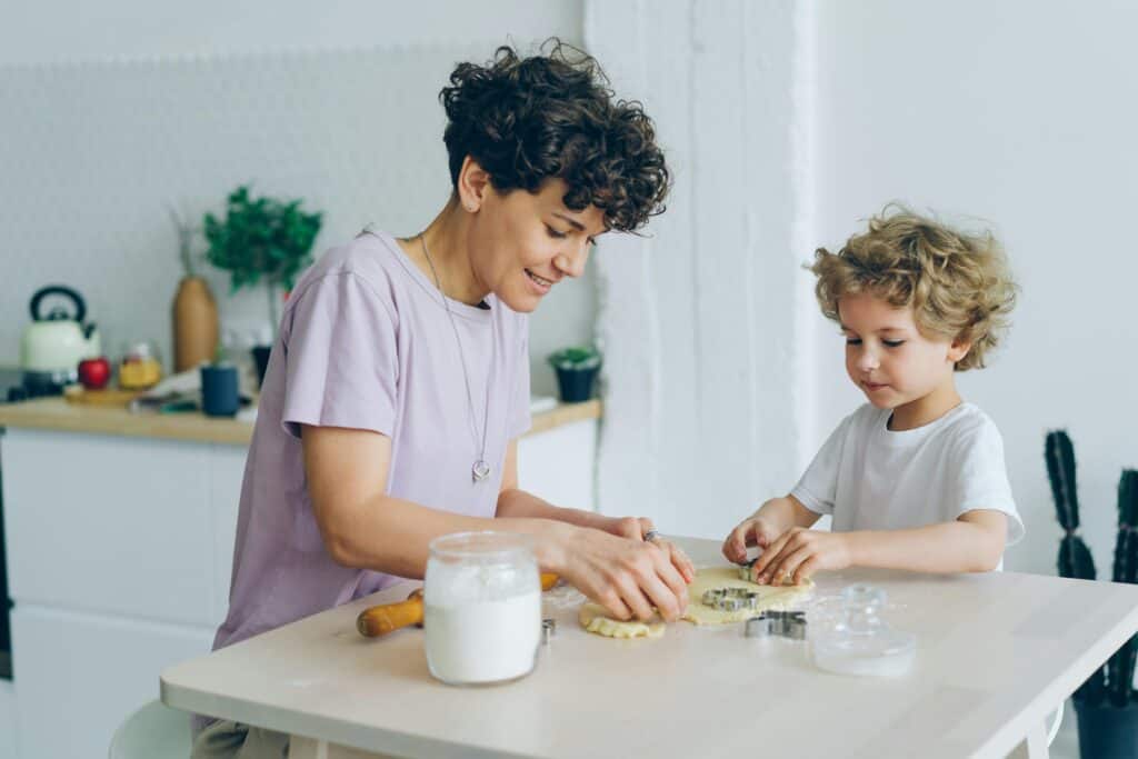 mom and son making cookies